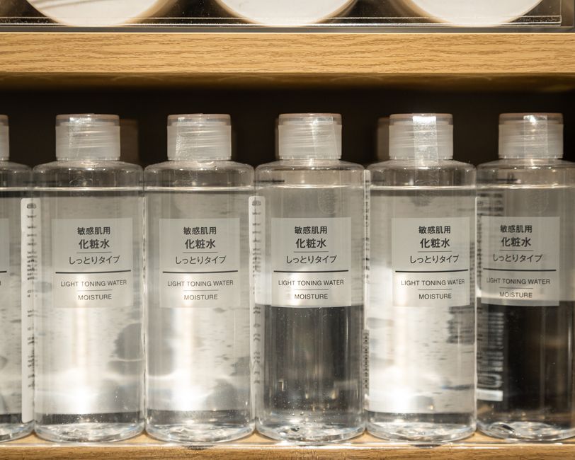 Close-up of Muji light toning water moisture bottles on a shelf.